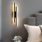 Sleek black LED wall light installed in a modern living room